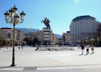square with few people and  monument of Alexander the Great , City center of Skopje on clear sunny day copy space